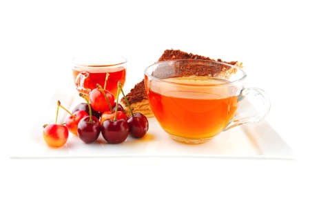 chocolate cakes with tea and cherryの写真素材