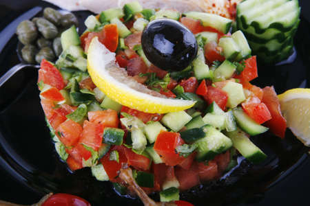 grille chicken meat chunks served black over whiteの写真素材