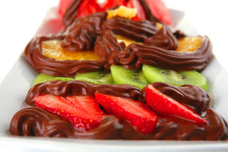 red grapfruit with kiwi and strawberry in chocolateの写真素材