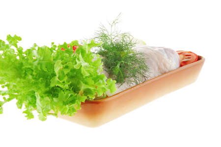 chicken drumstick and green lettuce over white backgroundの写真素材