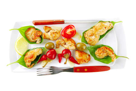 chicken brisket on white plate and basilの写真素材