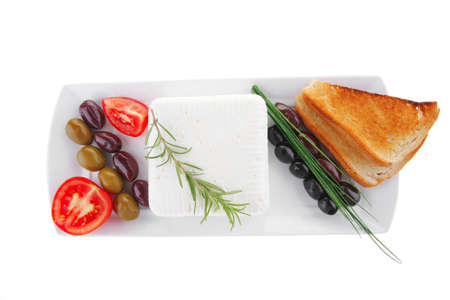 image of soft feta cube and bread toast on plateの写真素材