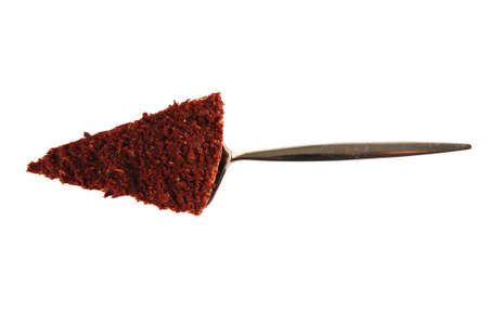 chocolate cake on metal paddle on whiteの写真素材