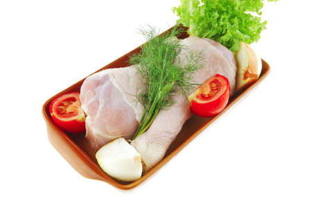 chicken drumstick and green lettuce over white backgroundの写真素材