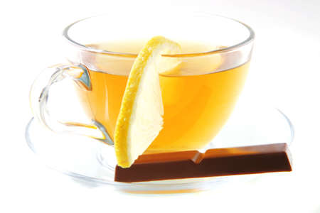 black tea and chocolate bar on whiteの写真素材