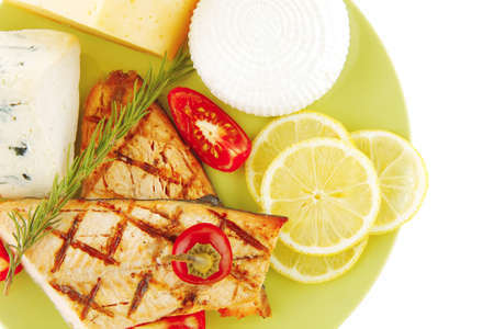 roast salmon and soft cheeses on green over whiteの写真素材