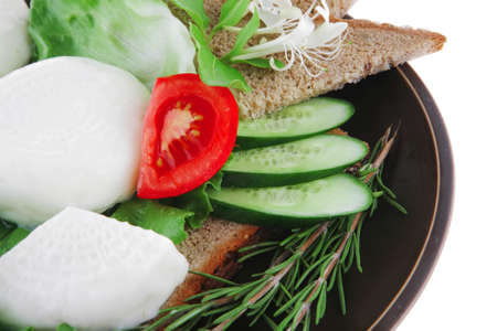 soft mozzarella served with bread on dark plateの写真素材