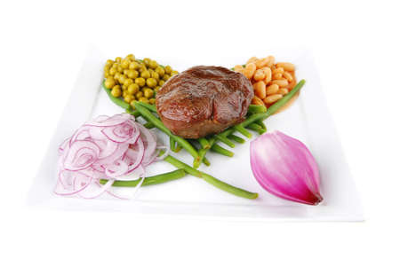 roast meat medalion on green beans with vegetablesの写真素材