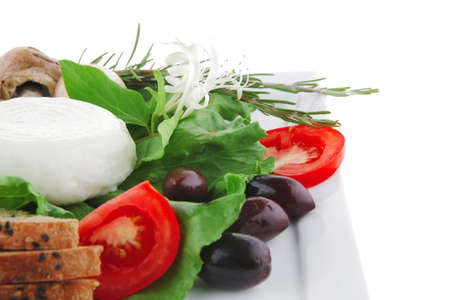 mozzarella cheese and tomatoes over white plateの写真素材