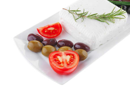 image feta cube and olive over white plate with breadの写真素材