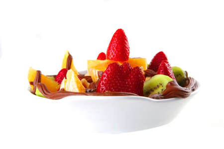 tropical raw fruits with in hot chocolate creamの写真素材