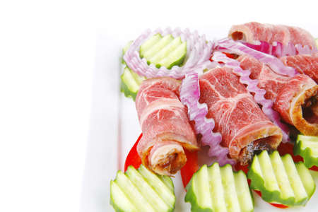 fresh served roasted meat rolls on white platterの写真素材