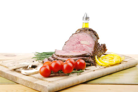 hot ham on wooden plate served over wood tableの写真素材