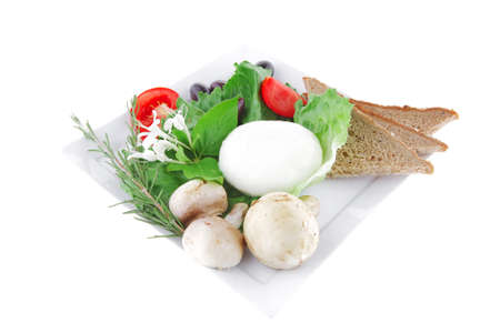 white cheese and bread with olives and tomatoesの写真素材