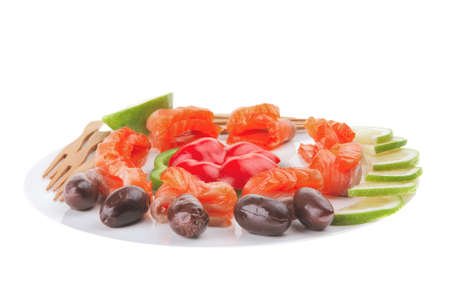 salmon with olives on white round plateの写真素材