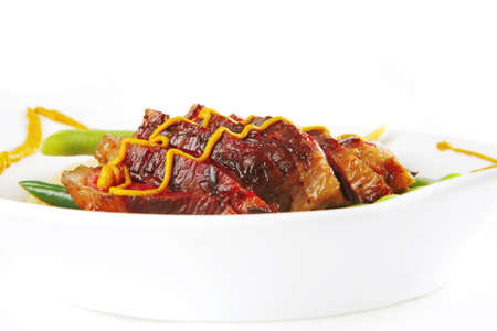 roasted beef served with beans and mustardの写真素材