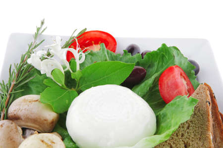 salad and low fat cheese on white plateの写真素材