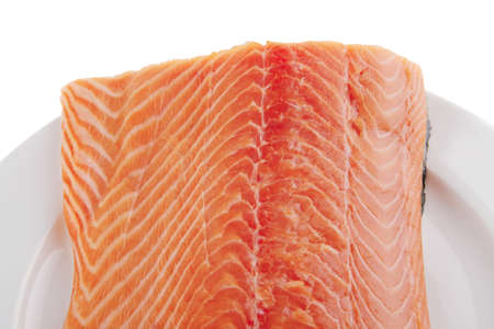 fresh raw red fish fillet on white plate