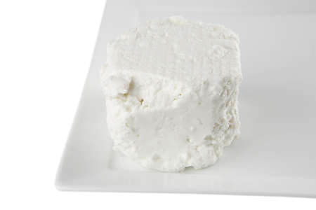 light soft cheese on plate over whiteの写真素材