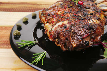 served ribs with rosemary and cherry tomatoの写真素材