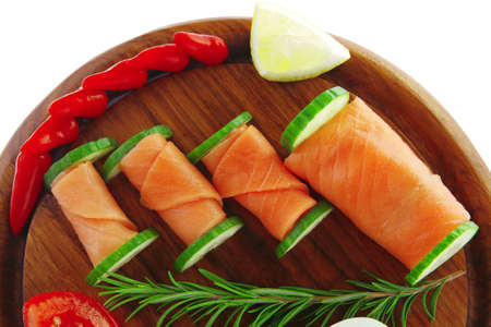 image of smoked salmon slices on dark woodの写真素材