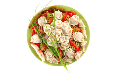 fresh boiled meat dumplings served with chives on greenの写真素材