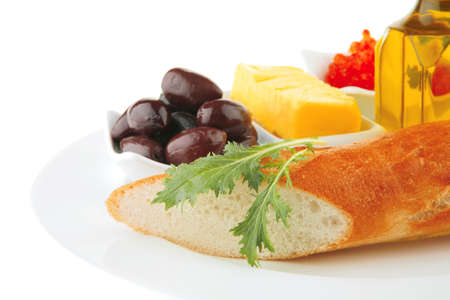 olive oil,caviar, and baguette over white plateの写真素材