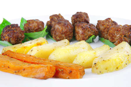 fried french cutlets with potatoes and basilの写真素材