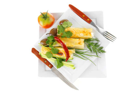 cheese cannelloni served with vegetables on white dishの写真素材