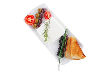 soft white cheese with bright toast and olivesの写真素材