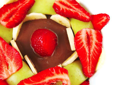 served fresh strawberries and slices over white plateの写真素材