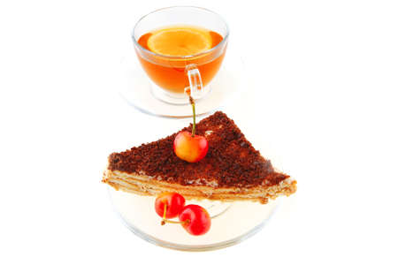 cherry cake and golden tea on whiteの写真素材