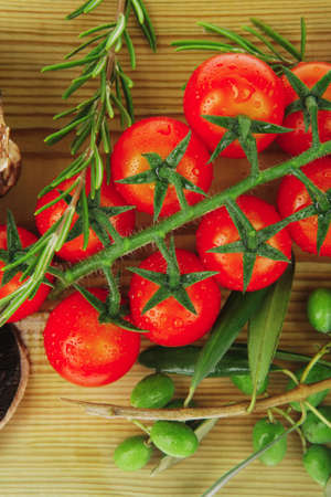 fresh raw vegetables served on wooden boardの写真素材