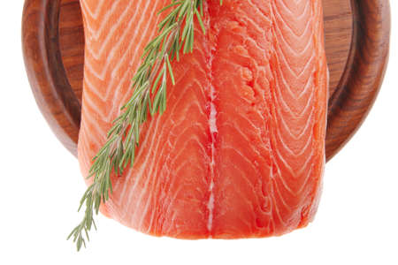 raw big salmon bar on wood plate and rosemaryの写真素材