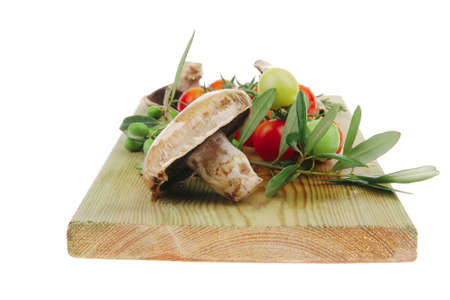 fresh prepared raw vegetables on cutting boardの写真素材