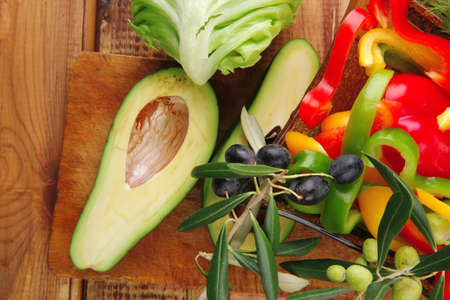 uncooked fresh vegeatbles prepared for use on wood
