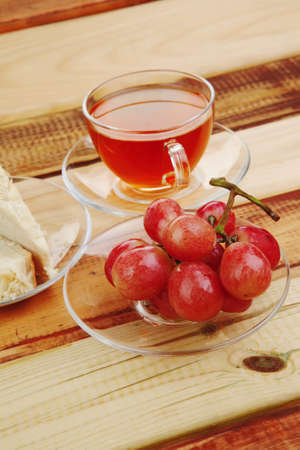 sweet food : cake dessert and tea and grapes on woodの写真素材