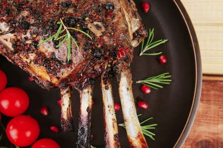 served charbroiled ribs on plate over woodの写真素材