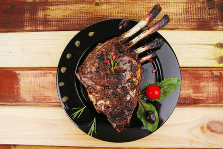 served ribs with rosemary and cherry tomatoの写真素材