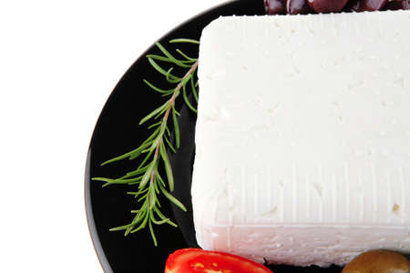 image of feta cube on black plateの写真素材