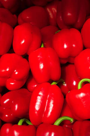 fresh raw lot of bell pepper on counterの写真素材