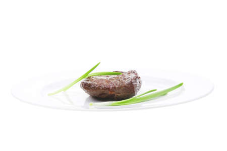 meat savory : grilled beef fillet mignon served on white plate isolated over white background with sproutsの写真素材