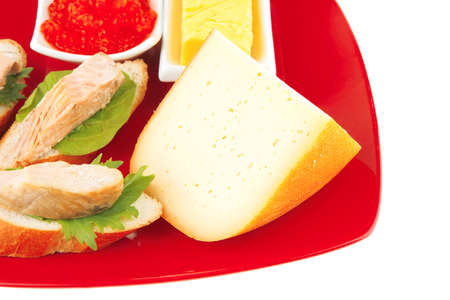 fried salmon chunks and cheese piece on redの写真素材