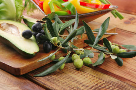 uncooked fresh vegeatbles prepared for use on woodの写真素材