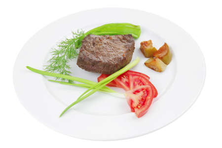 meat savory : grilled beef fillet mignon served on white plate isolated over white background with chili pepper and tomatoesの写真素材