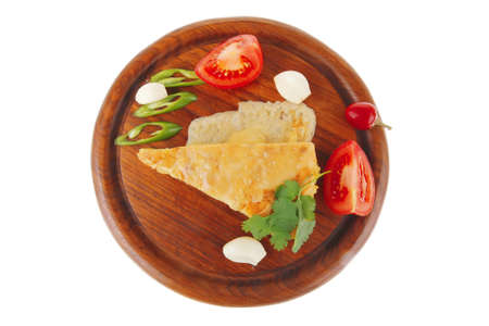 dairy food : vegetable cheese casserole slice on wooden plate served prepared with tomatoes  and...