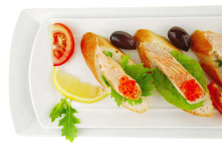 fried salmon on baguettes isolated over whiteの写真素材