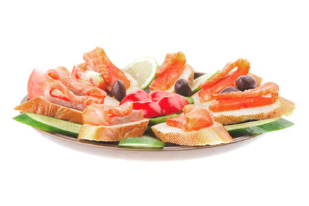 smoked salmon on baguette with olives and pepperの写真素材