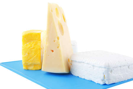 soft delicious cheeses on blue plastic boardの写真素材