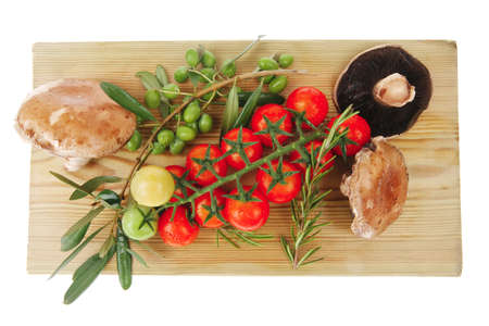 fresh raw vegetables served on wooden boardの写真素材